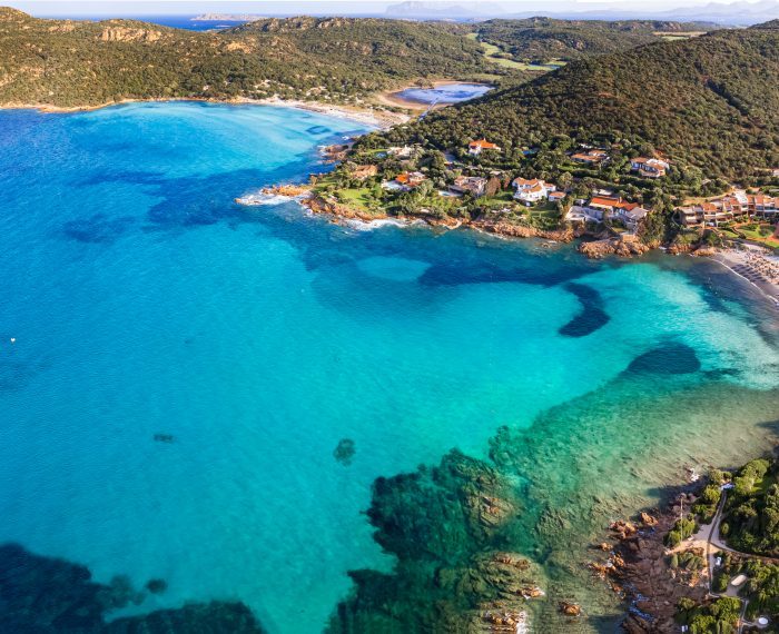 Sardegna (Sardinia) island aerial drone view of best beaches. Pevero beach near Porto Cervo in emerald coast (Costa Smeralda), Italy